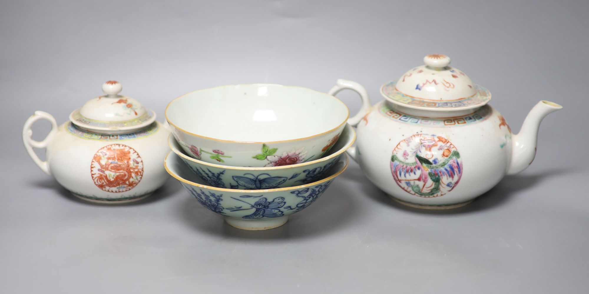 A Chinese famille rose teapot and sucrier, a 19th century Chinese bowl and a pair of blue and white bowls